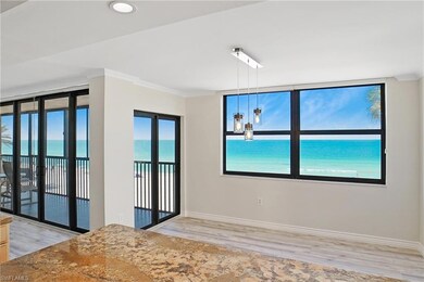 Spare room featuring ornamental molding, light woo
