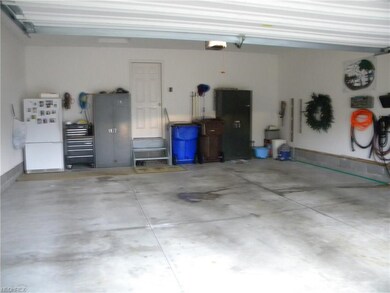 Large and clean garage with electric, water and fl