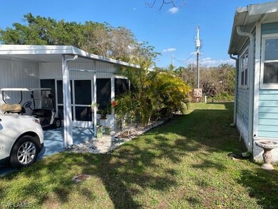 View of yard with a carport