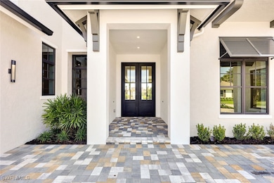 Doorway to property featuring french doors and stu