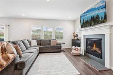 Living area featuring baseboards, a glass covered 
