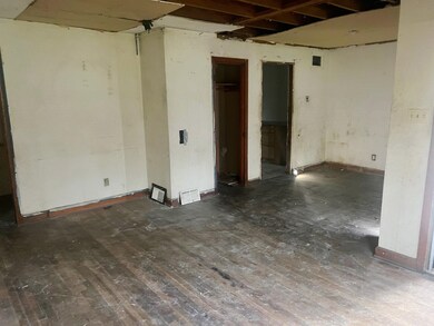 Unfurnished room featuring dark hardwood / wood-st