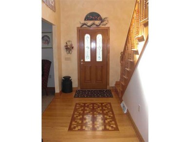 Entry/Foyer. Beautiful Oak hardwood floor and stai