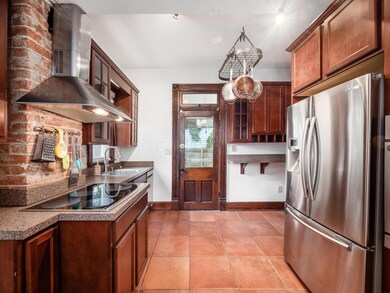 Featuring exposed brick, ceramic tile...