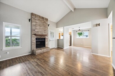 Unfurnished living room with wood finished floors