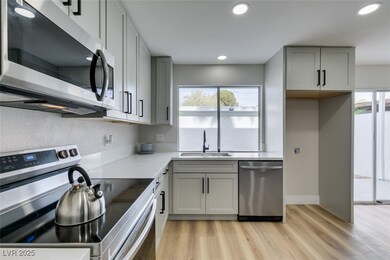 Kitchen with a sink, appliances with stainless ste