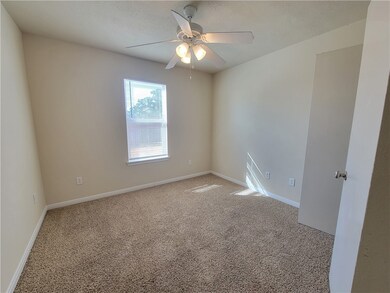Unfurnished room featuring light colored carpet an