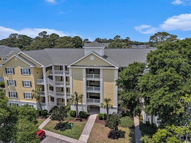 View of property with uncovered parking