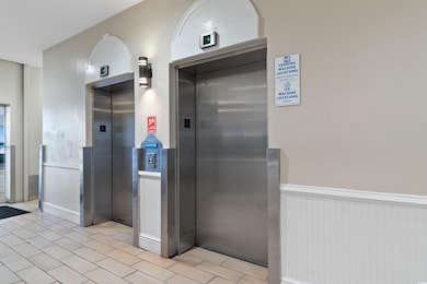 Interior space with elevator and wainscoting