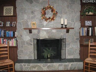 Somewhat rustic, yet beautiful woodburning fireplace in family room. A wonderful feature especially during the winter holiday season!
