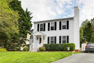 Big front yard with paved driveway.