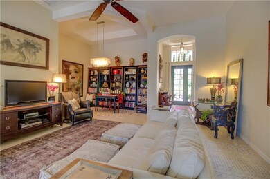 Tiled living area with volume ceilings