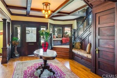 Stunning foyer facing the front of the home and staircase with second love seat.