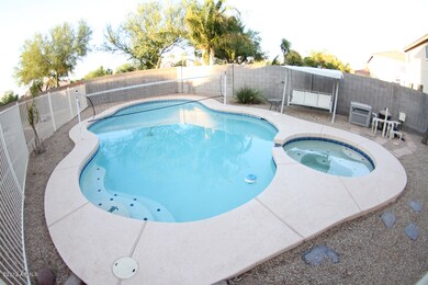 fenced pool and spa area