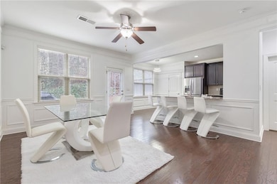 Dining area with a decorative wall, dark wood-styl