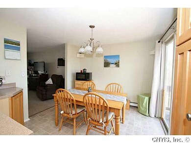 Dining Room. Newer large Pella sliding door leads out to a full length deck with stairs leading down to a private fully fenced yard.