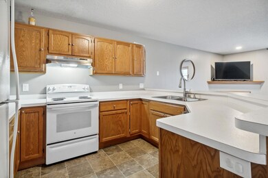 Another view of the kitchen as it looks into the living room area. Newer dishwasher!