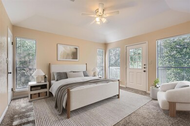 Carpeted bedroom with access to outside, baseboar
