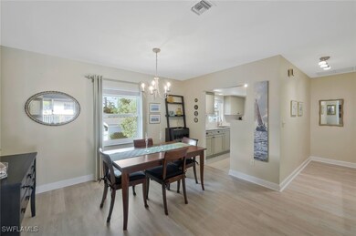 Dining room with chandelier, luxury vinyl flooring