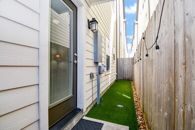 Rear access door with a turf-lined walkway and eff