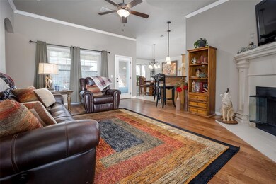 Living room with a fireplace, ornamental molding, 