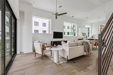 This multi-level condo features a luminous open floor plan on the second level with soaring 12' ceilings and recessed lighting. 