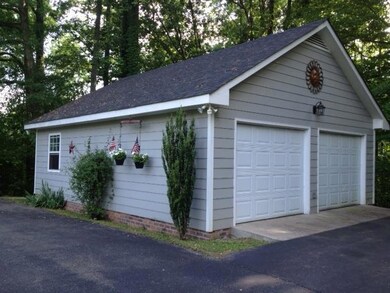 Spacious Detached 2 Car Garage, with Workshop Area.