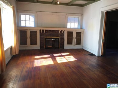 Living room has beautiful hardwood floors.
