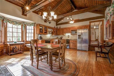 The Kitchen leads to a long Hallway to the Right.