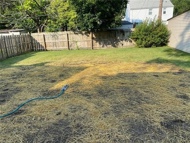Fenced in back yard. Recently regraded and seeded.