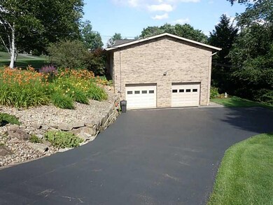 Parking Lot/Garage. Paved drive to integral garage
