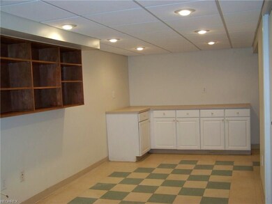 Other side of finished basement with room for your