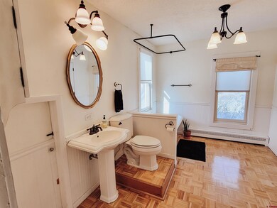 Primary bath with clawfoot tub.