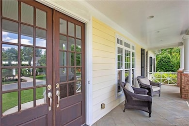 The french glass front doors are what welcome you in to this beautiful home.