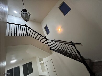 Stairway featuring recessed lighting