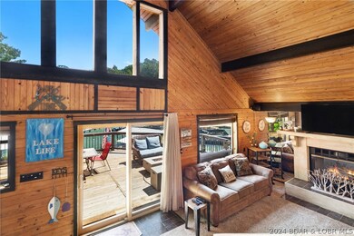 Main living area is accented with real wood paneli