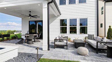 View of covered patio with outdoor lounge area. Photos are of the Tallulah Model Home and are not representative of actual home. Designer features may vary.
