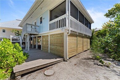 View of home's exterior featuring a sunroom and stairway