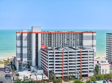 View of apartment building / complex featuring a water view