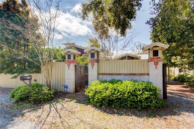 Beautiful high tabby wall with gates creates priva