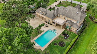 An aerial view of the swimming pool, spa and the l