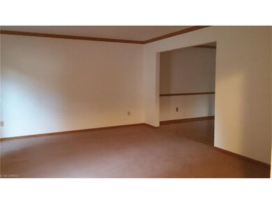 Oversized formal living room with crown molding!