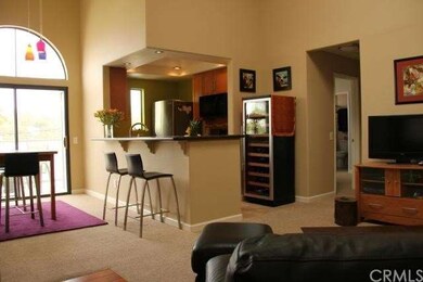 Terrific living, dining, and kitchen area with bar
