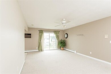 Second view of the living room offers a view of th