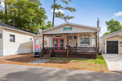 View of front of home with a porch and french doors