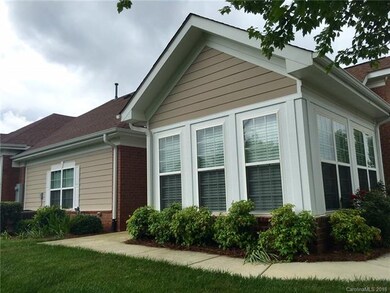 Front Side of townhome overlooks wooded common are