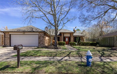 The front of the home has excellent curb appeal with a brick elevation and mature landscaping.