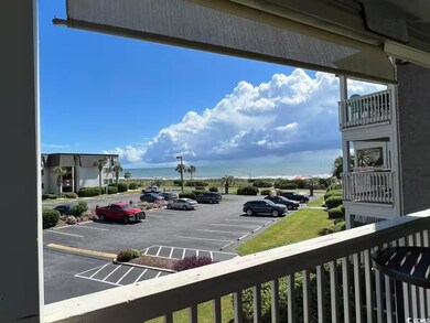 View of parking / parking lot with a water view
