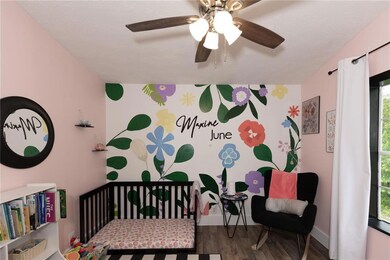 Bedroom with wood finished floors and ceiling fan