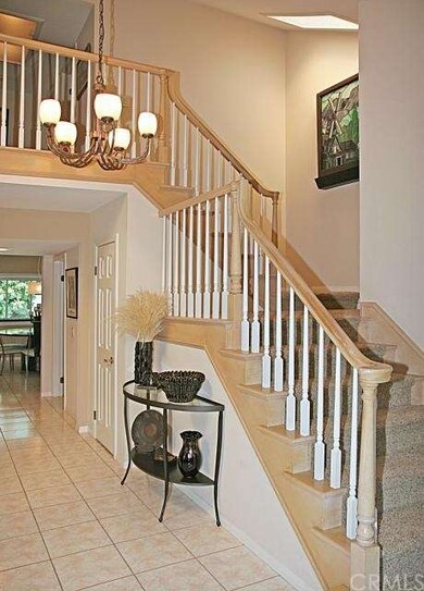 Attractive Open Staircase with Natural Wood Railin